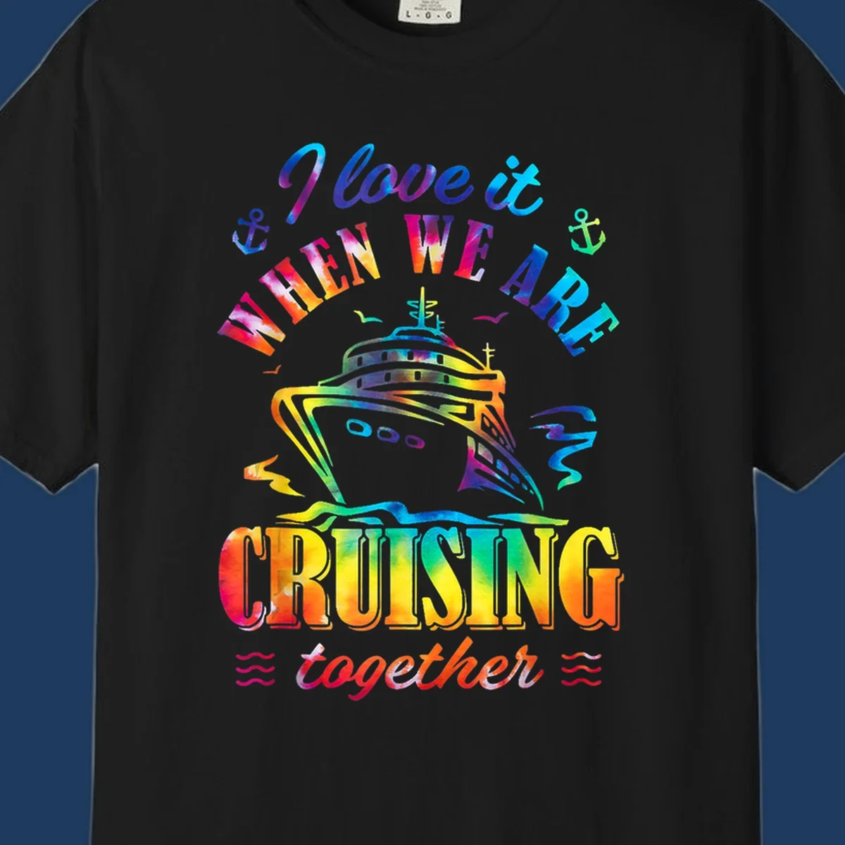 Colorful cruise ship design with 'I love it when we're cruising together' text, anchors, and waves on gray background