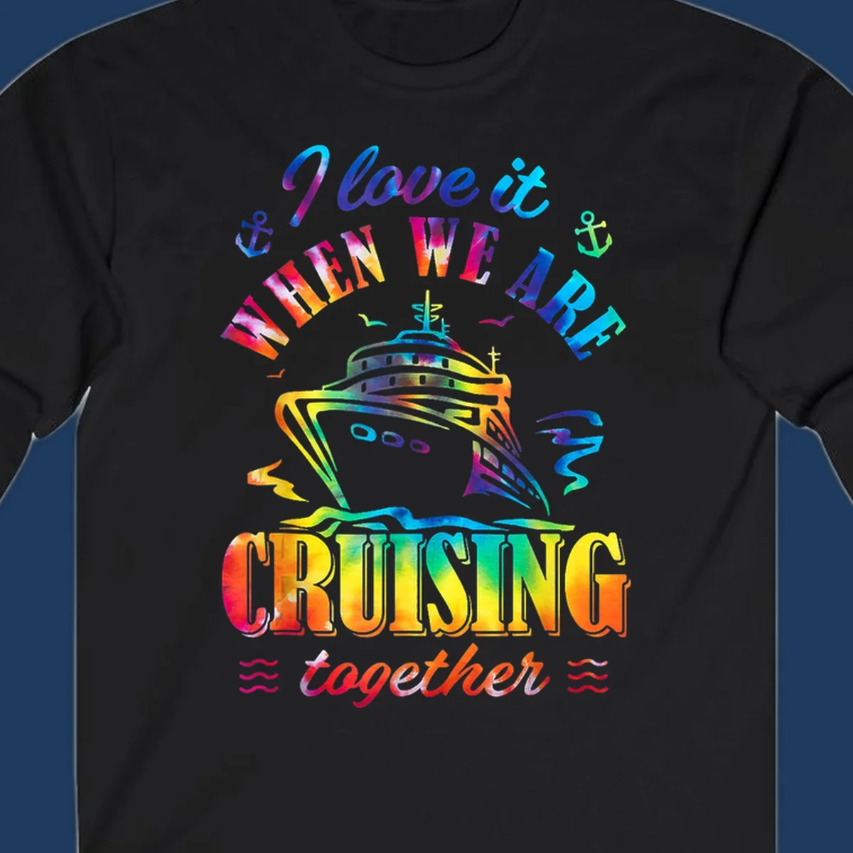 Colorful cruise ship design with 'I love it when we're cruising together' text, anchors, and waves on gray background