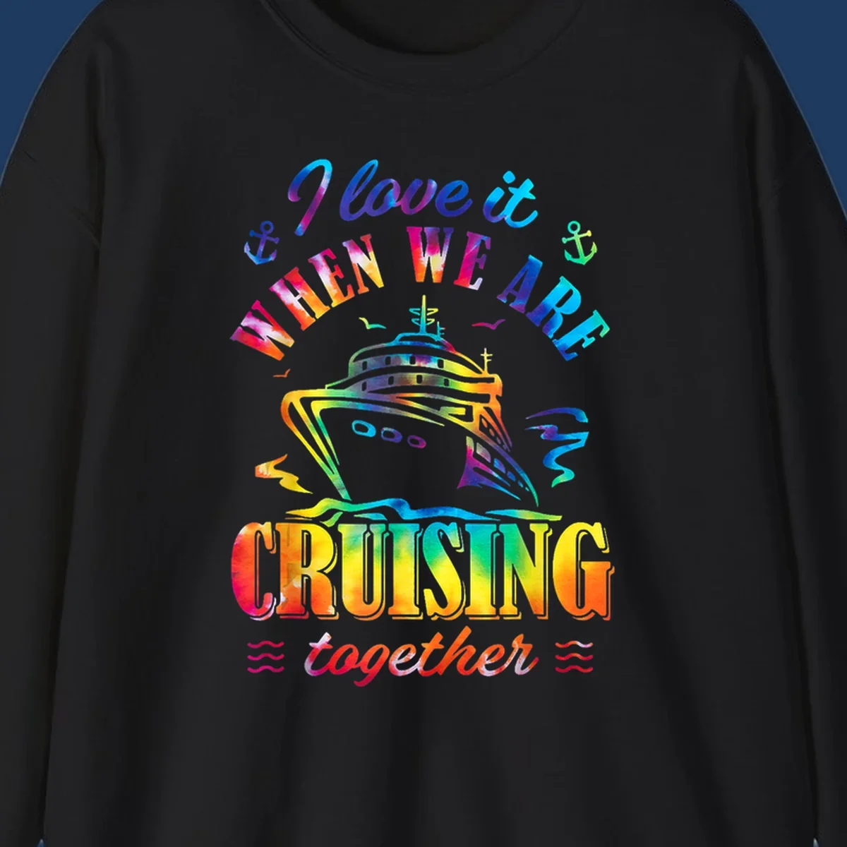 Colorful cruise ship design with 'I love it when we're cruising together' text, anchors, and waves on gray background