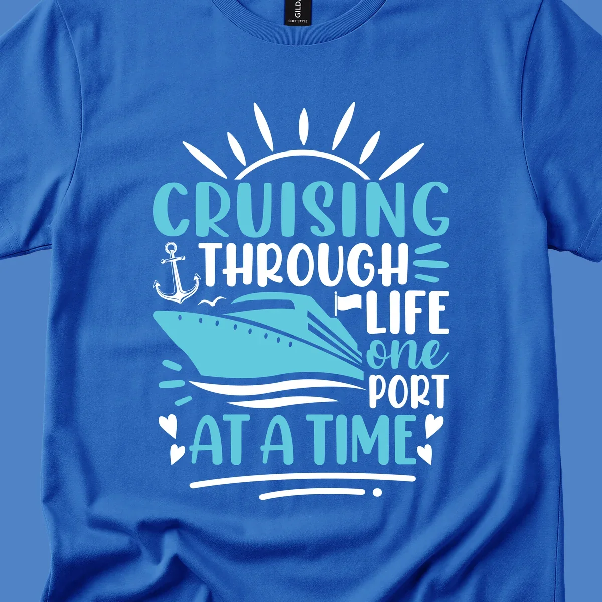 Cruise ship with anchor and sun rays design featuring text 'Cruising Through Life One Port At A Time' in turquoise and white on gray background