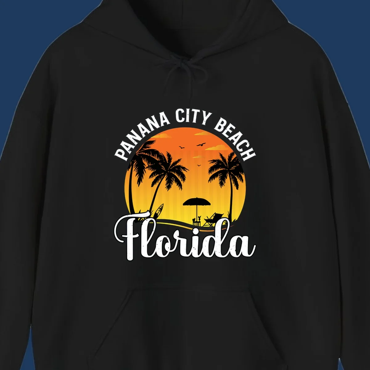Panama City Beach tiki-themed sunset illustration with palm trees, lounge chair, umbrella, and sailboat silhouettes against warm orange and gold sky