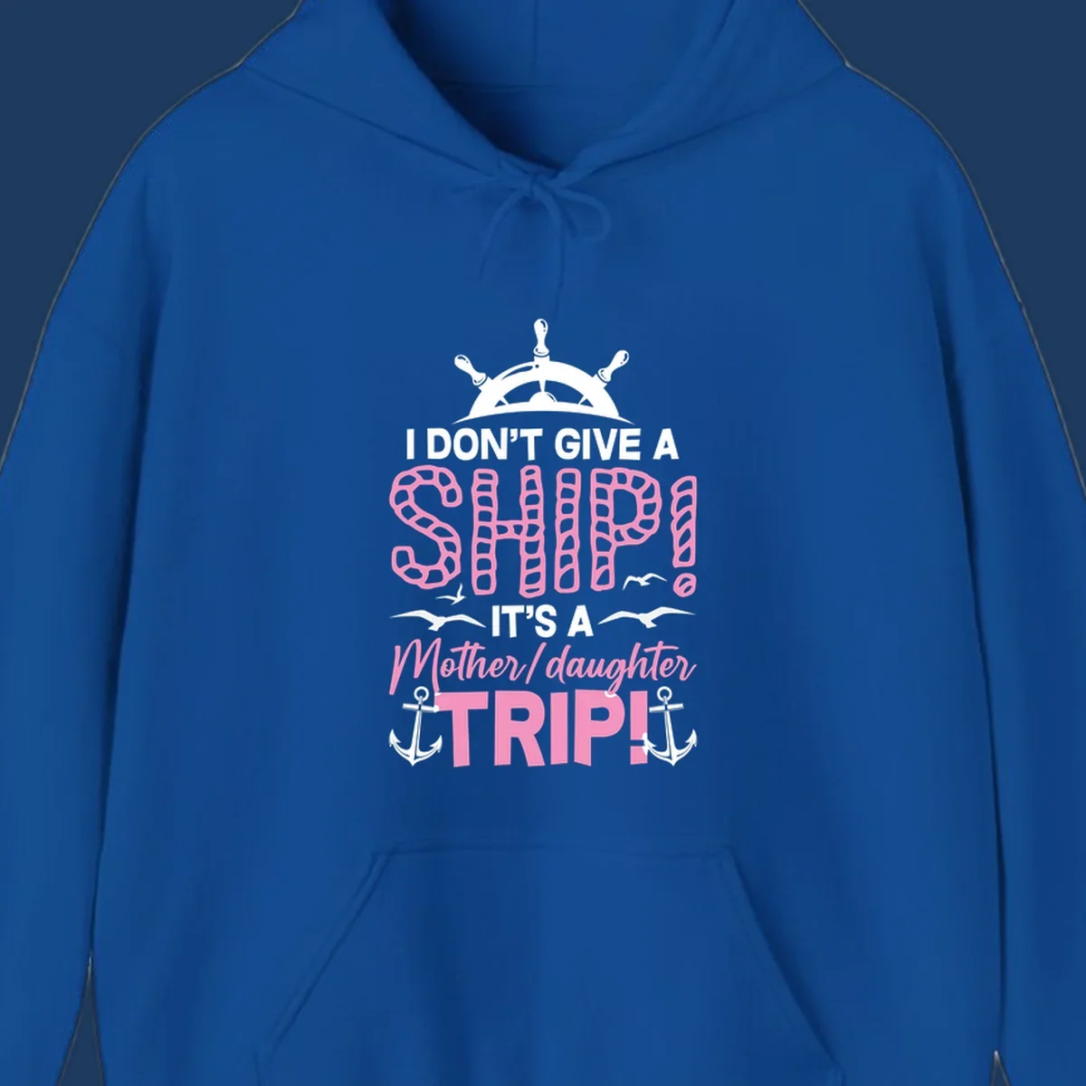 Gray design with ship wheel, anchors, and pink textured lettering reading 'I Don't Give A Ship It's A Mother Daughter Trip' - a nautical cruise humor design