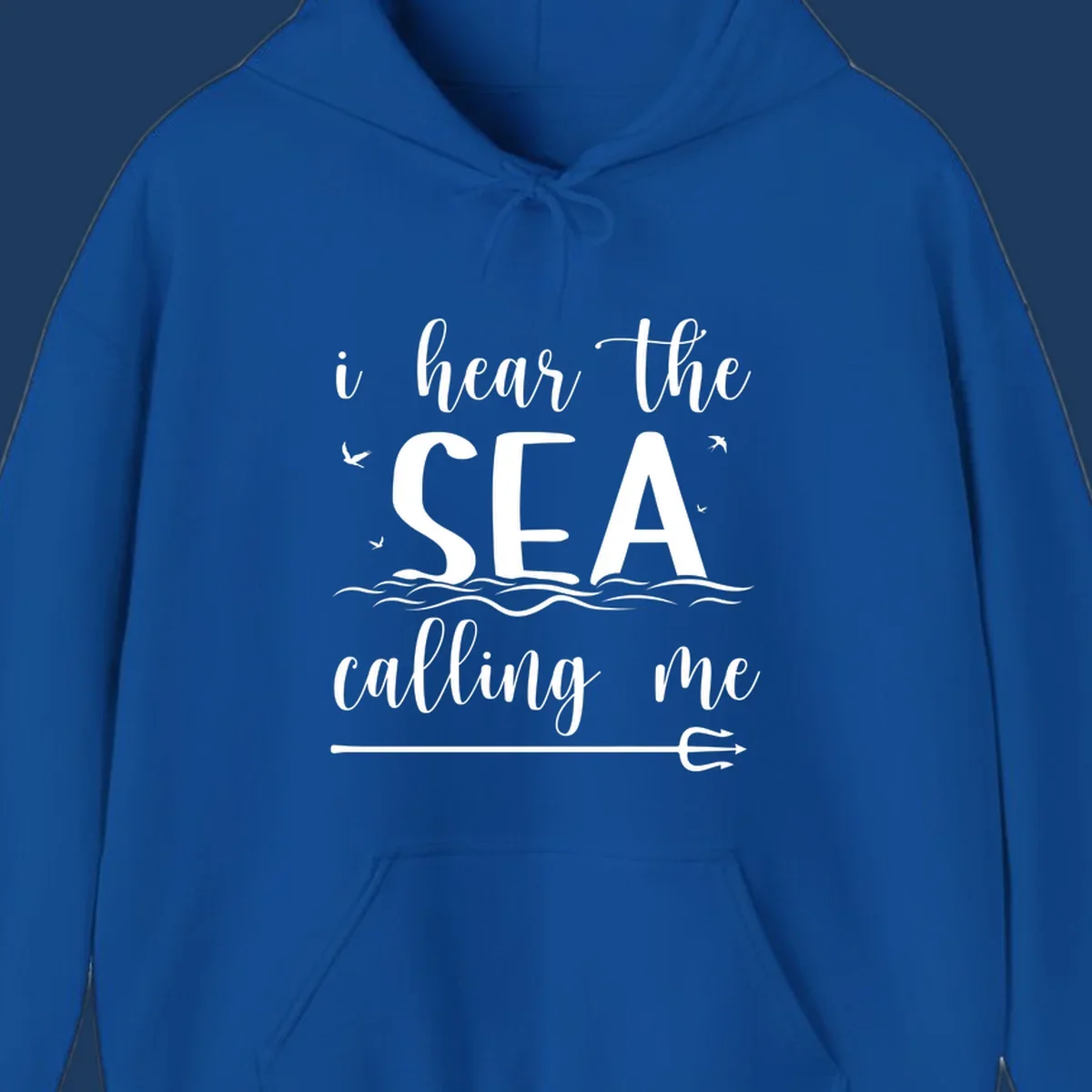 White nautical design with 'i hear the SEA calling me' text, ocean waves, seabirds, and trident anchor on gray background