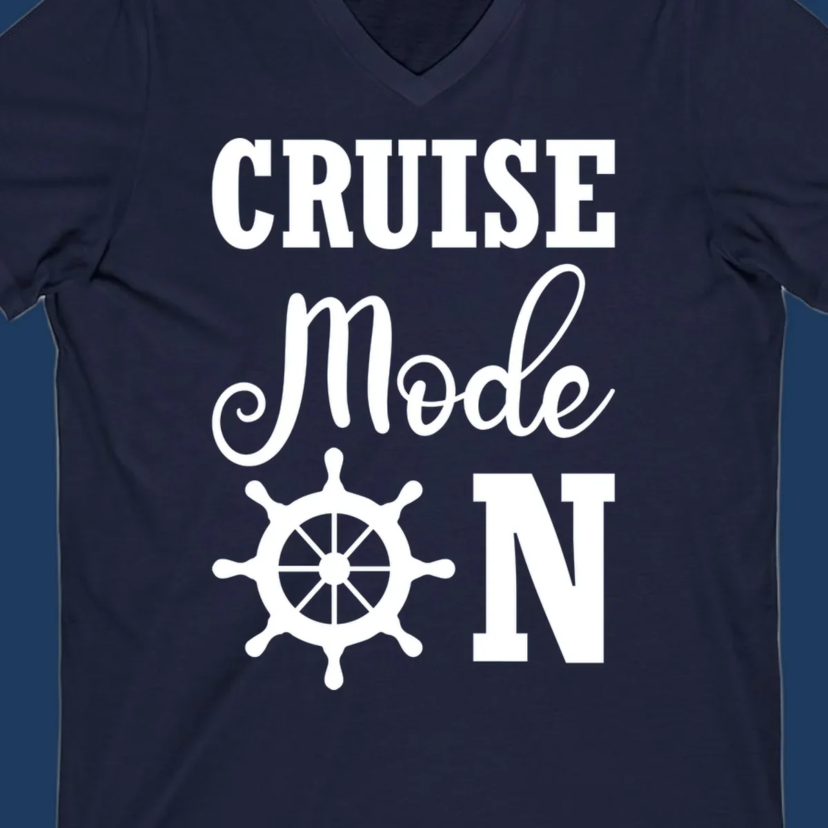 White ship wheel with cruise mode text design on gray background for nautical vacation apparel