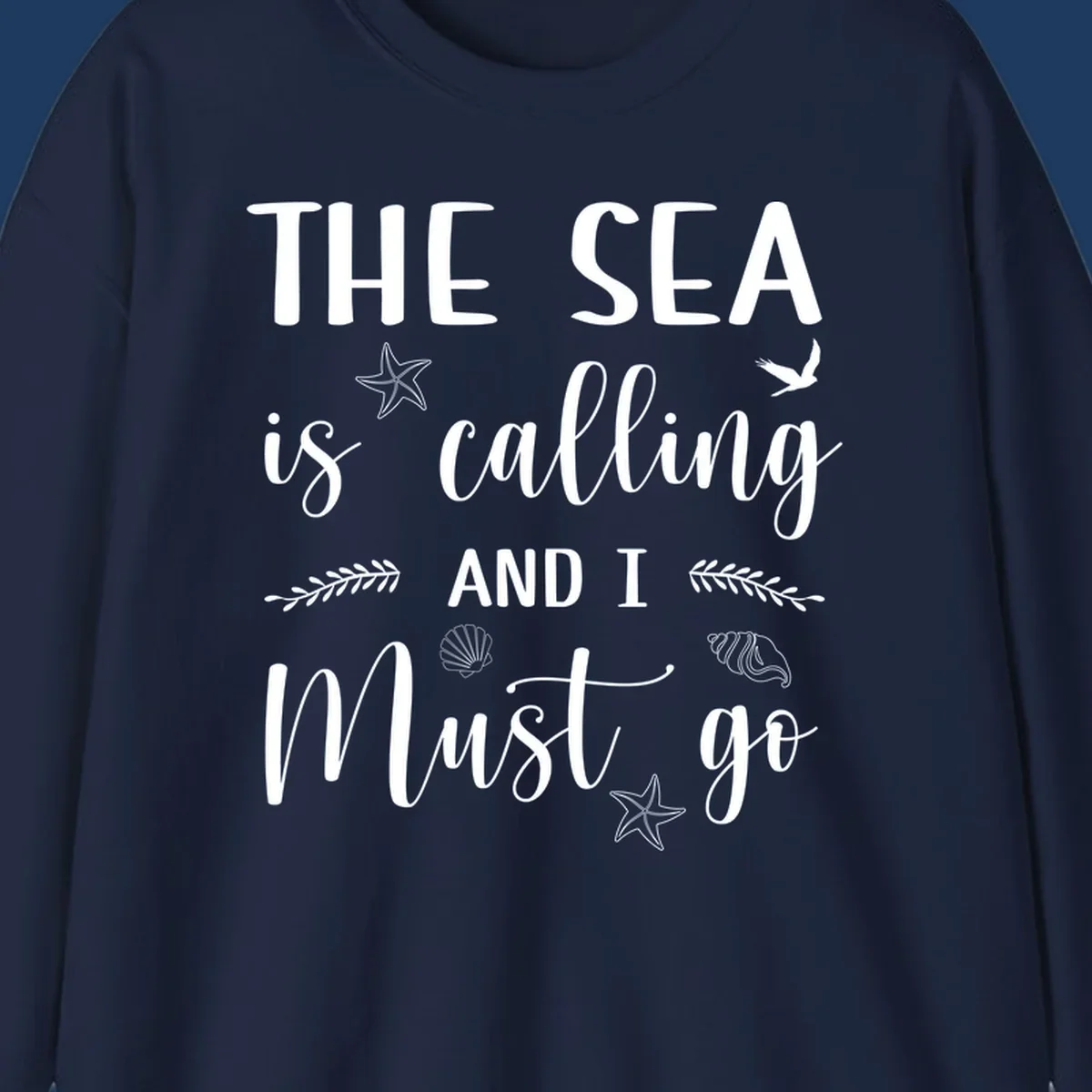 Gray design with white text reading 'The Sea is calling and I must go' surrounded by starfish, seashells, seaweed, and seabird illustrations