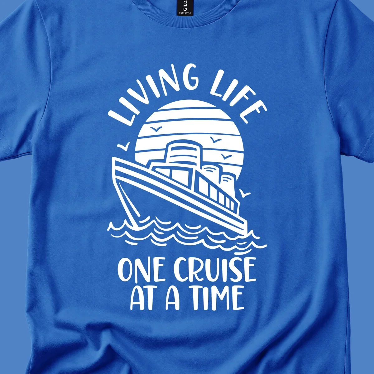 Line art illustration of a cruise ship on ocean waves with sunset, text reading 'Living Life One Cruise At A Time'