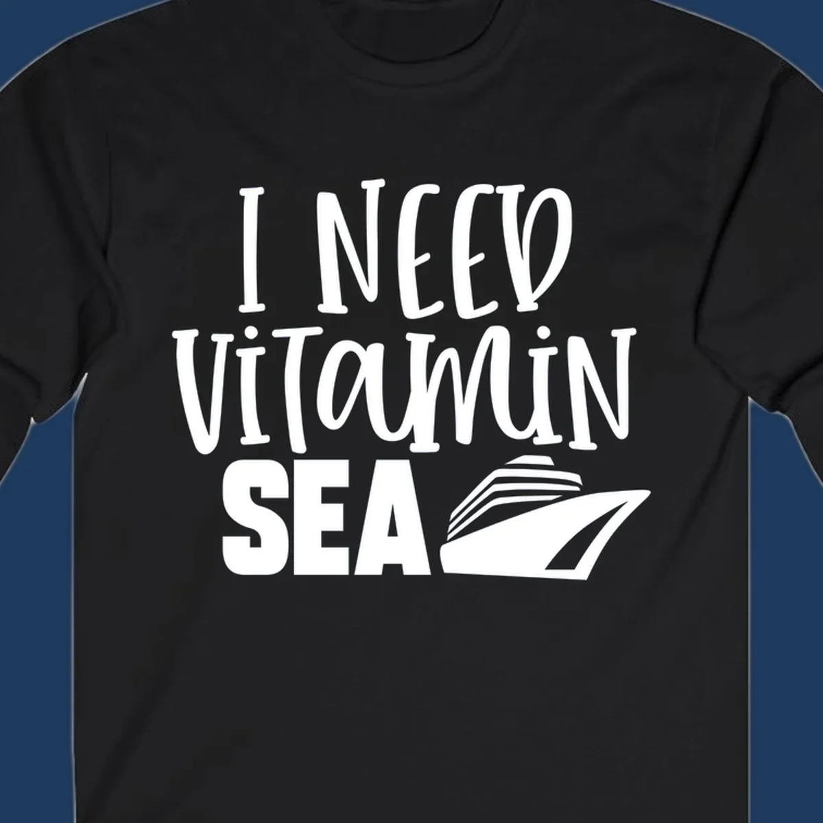 White text reading 'I Need Vitamin Sea' with a stylized cruise ship illustration on gray background