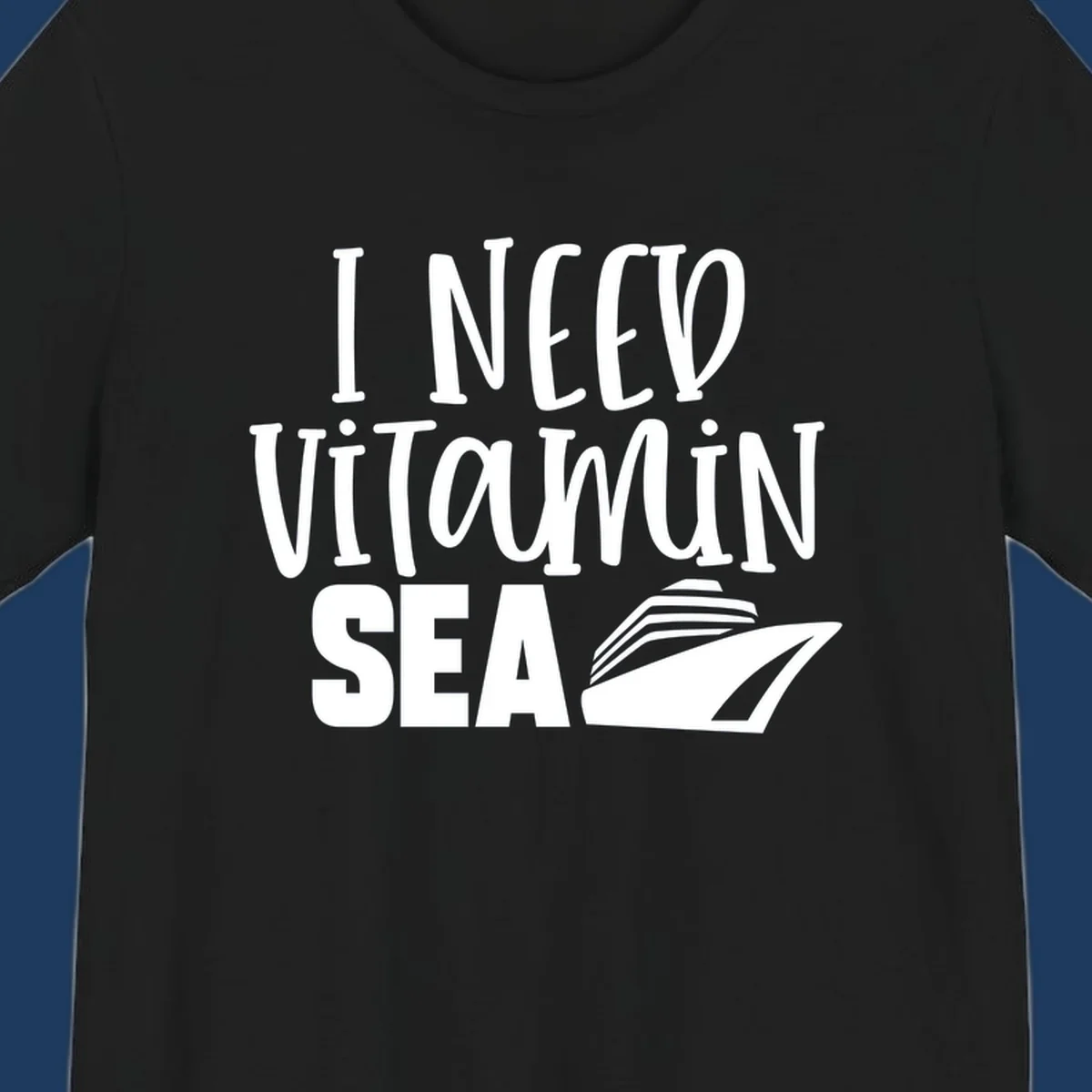 White text reading 'I Need Vitamin Sea' with a stylized cruise ship illustration on gray background