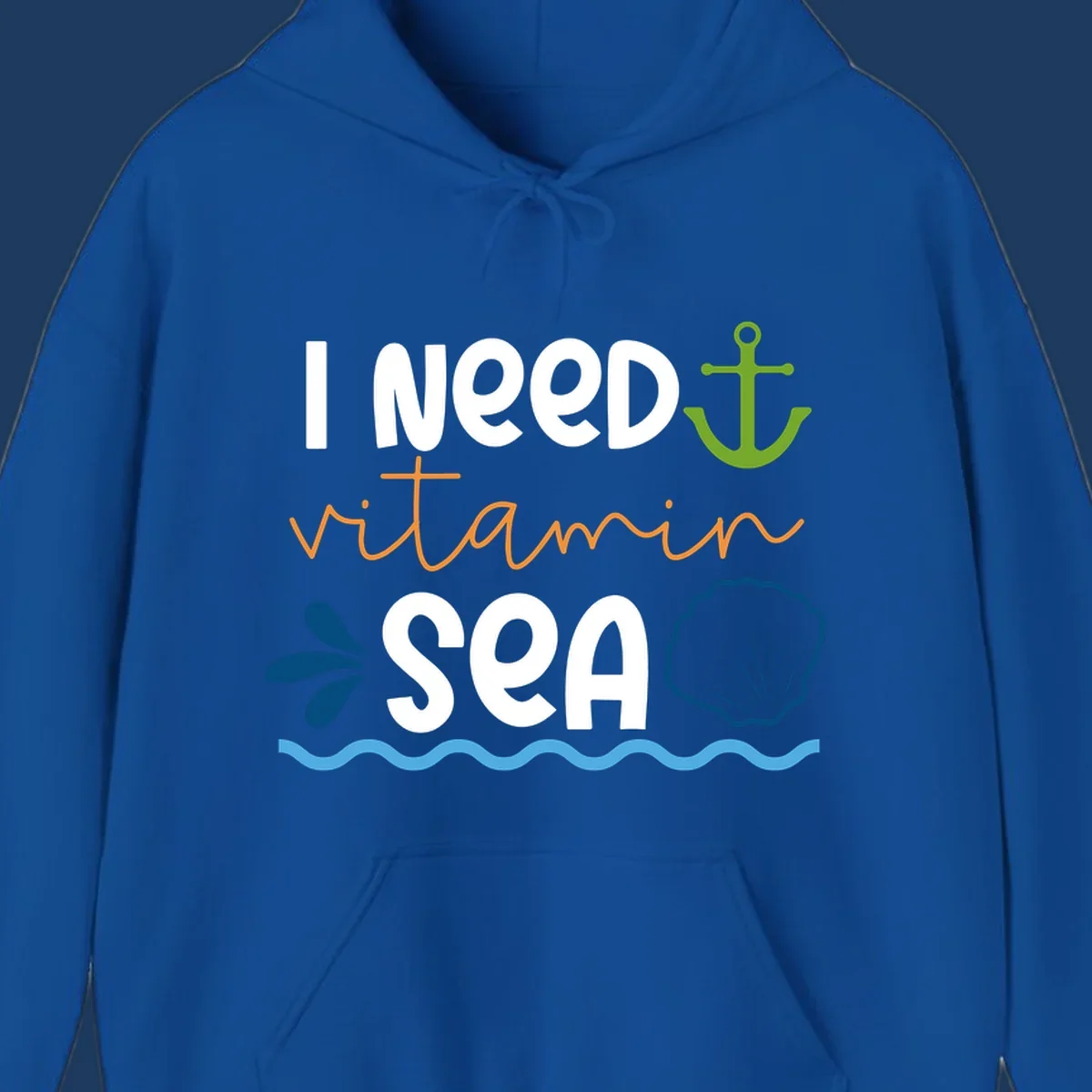 Nautical design with white text reading 'I Need Vitamin Sea' surrounded by anchor, shells, waves, and water droplets in orange, green, and blue