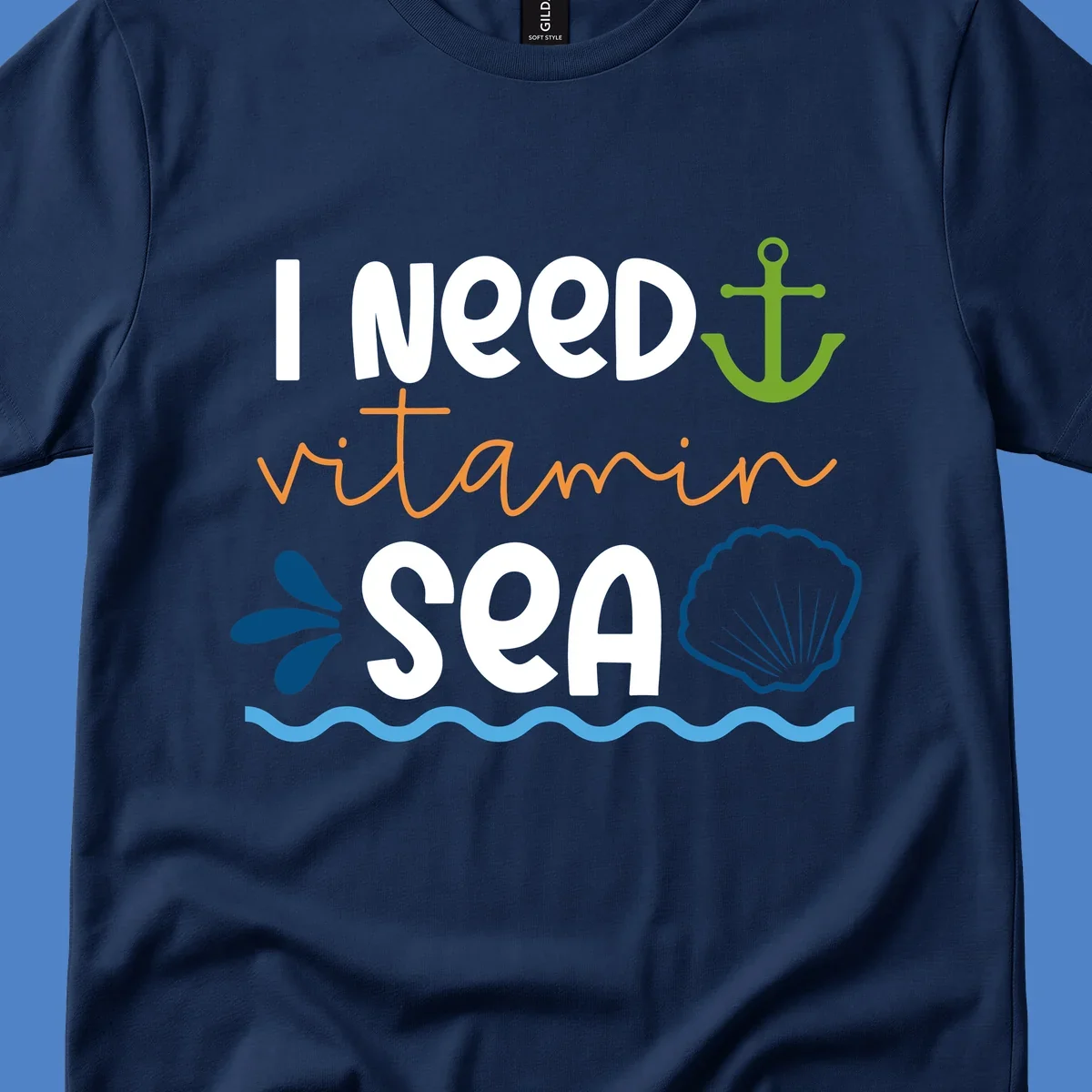 Nautical design with white text reading 'I Need Vitamin Sea' surrounded by anchor, shells, waves, and water droplets in orange, green, and blue