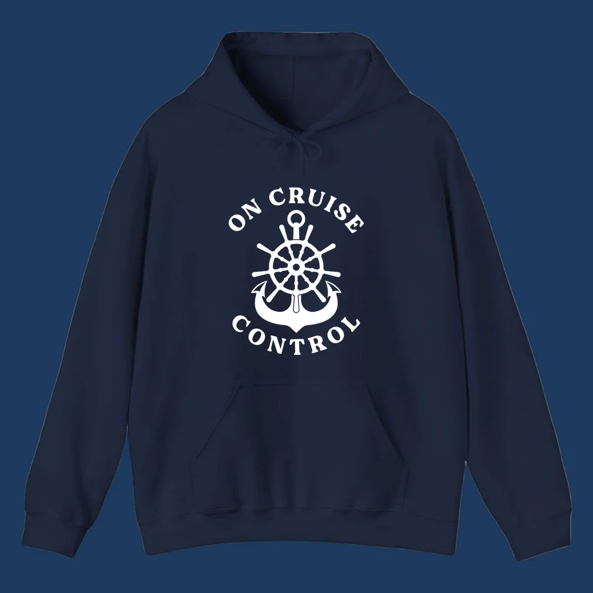 On cruise control nautical badge with ship wheel, anchors, crown and shield design in white on gray background.