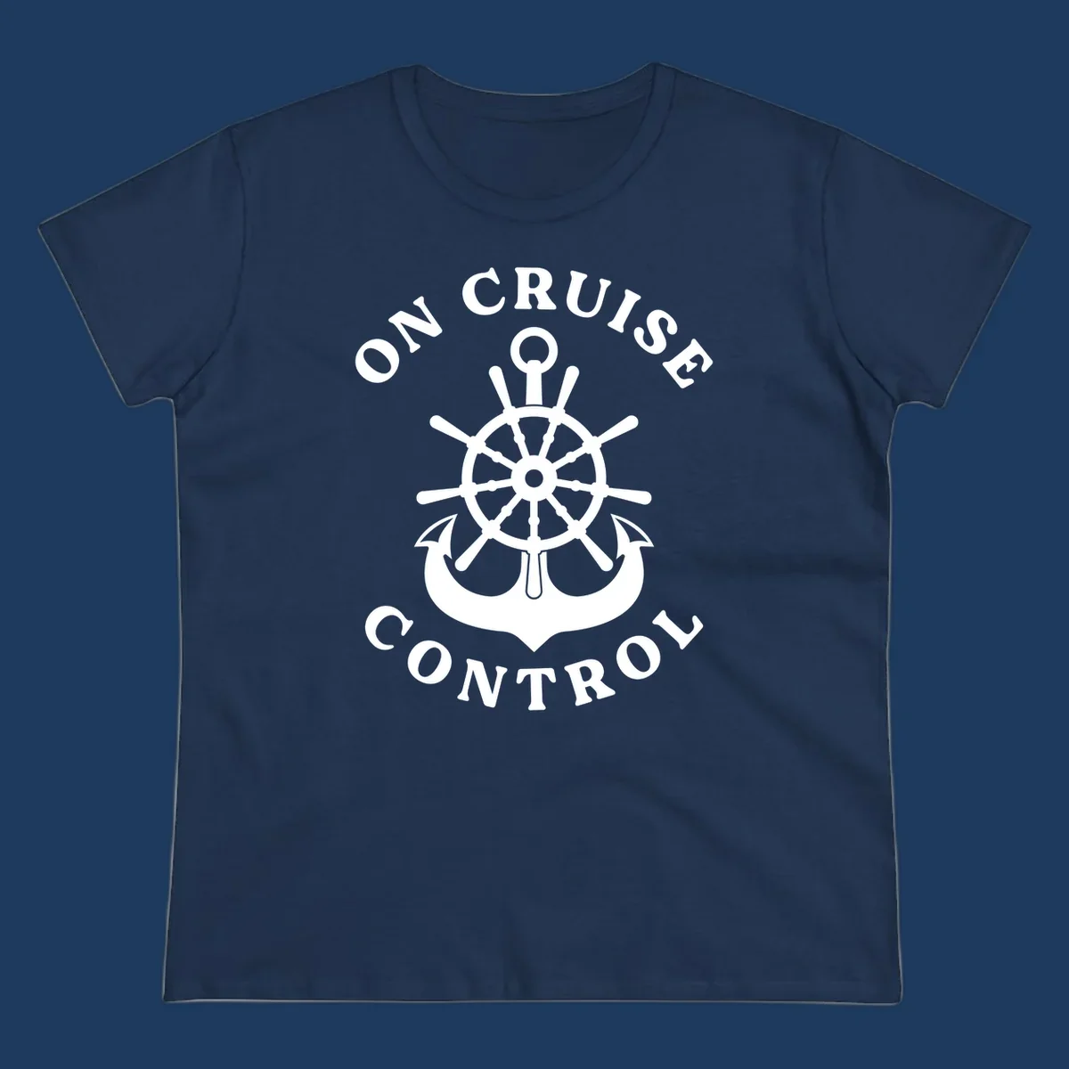 On cruise control nautical badge with ship wheel, anchors, crown and shield design in white on gray background.