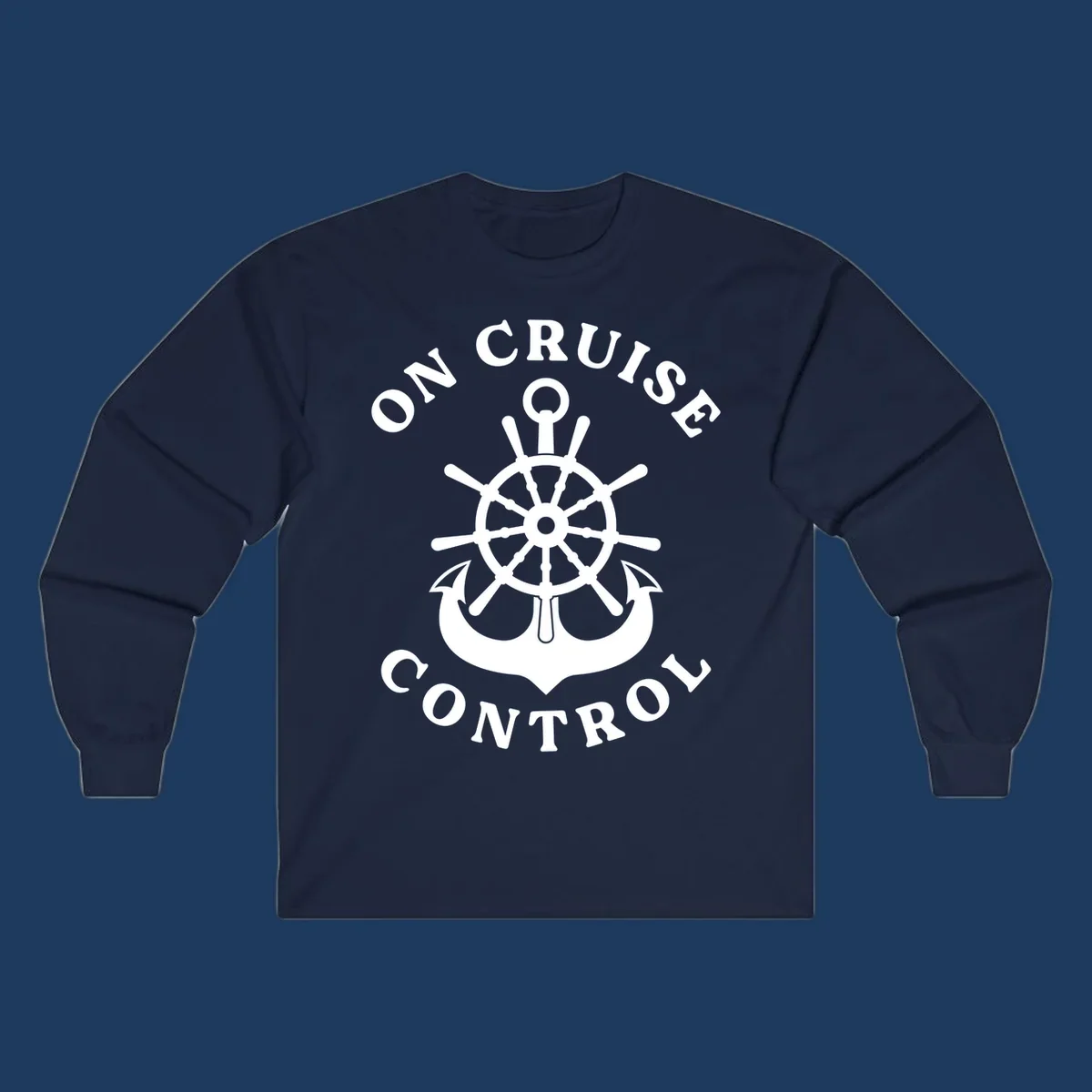 On cruise control nautical badge with ship wheel, anchors, crown and shield design in white on gray background.