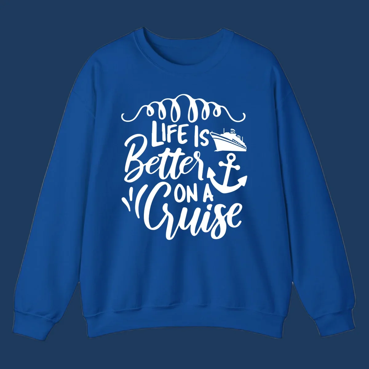 White nautical design with 'Life Is Better On A Cruise' text, cruise ship, anchor, and decorative wave swags on gray background