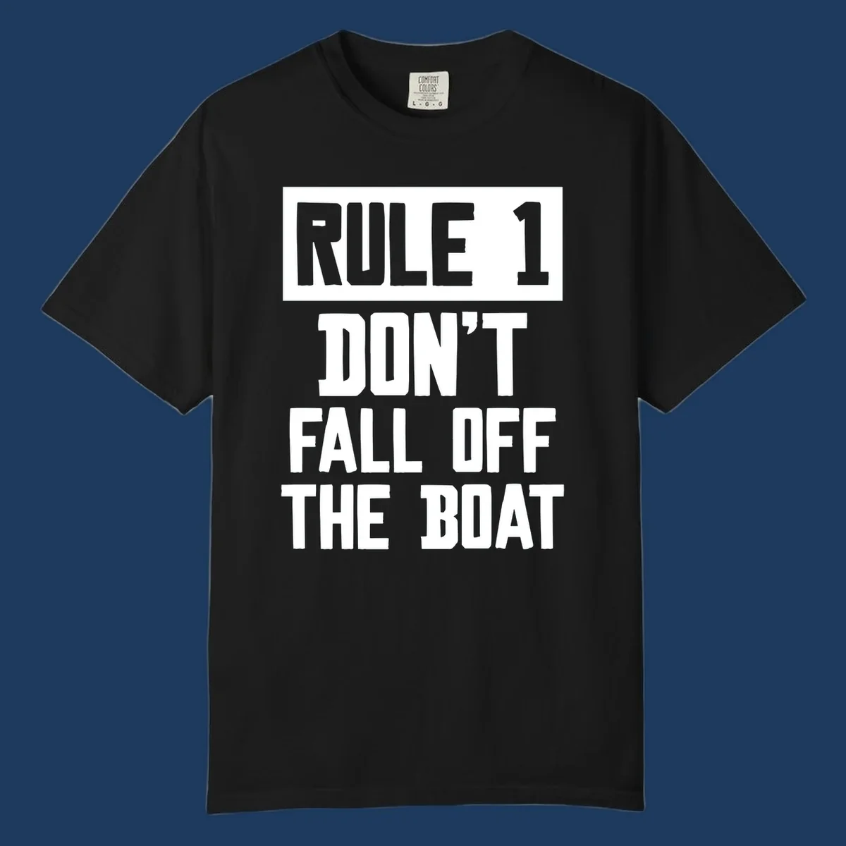 Bold gray and white typography reading 'Rule 1 Don't Fall Off The Boat' - a humorous nautical design