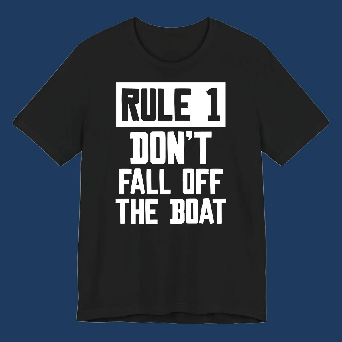 Bold gray and white typography reading 'Rule 1 Don't Fall Off The Boat' - a humorous nautical design