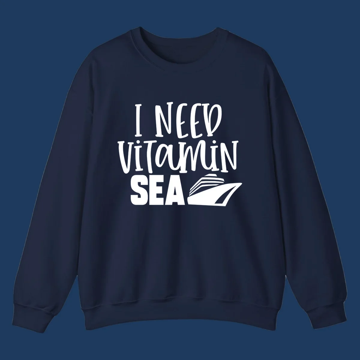 White text reading 'I NEED VITAMIN SEA' with a cruise ship illustration on gray background