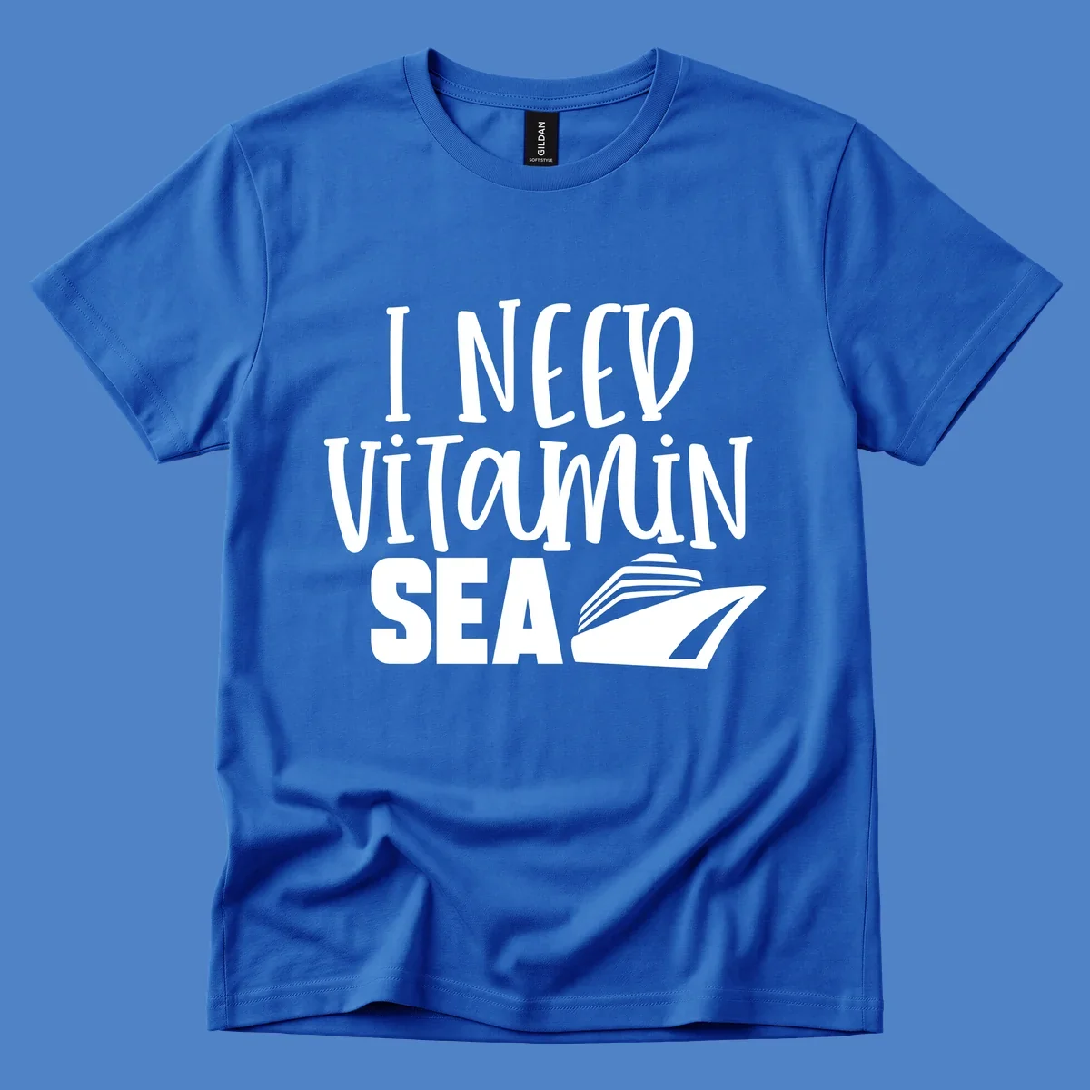 White text reading 'I NEED VITAMIN SEA' with a cruise ship illustration on gray background
