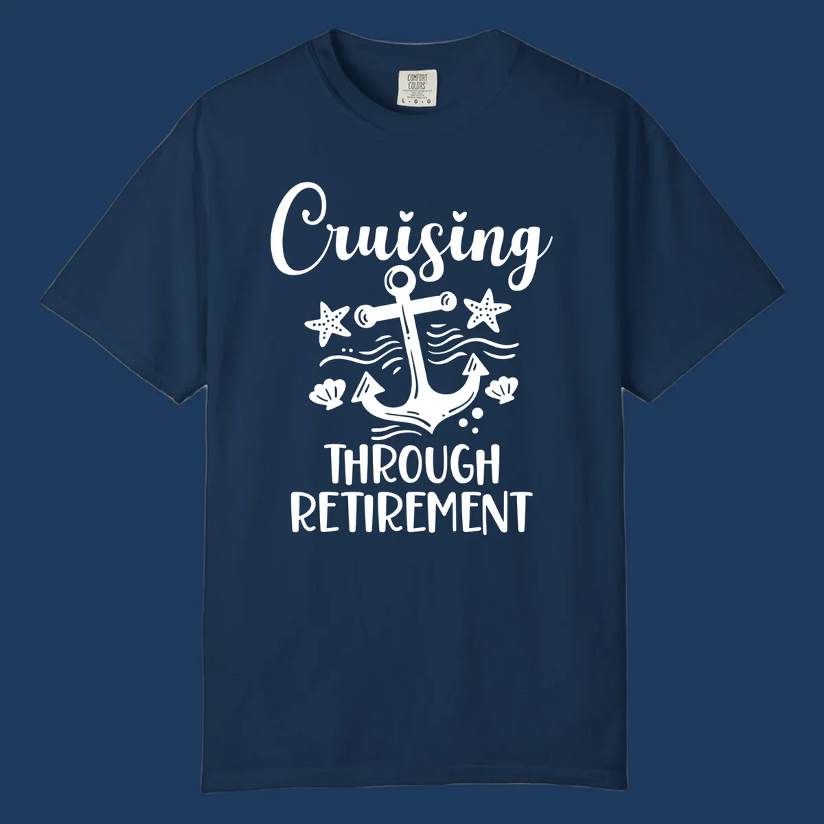 Cruising through retirement nautical design with white anchor, starfish, seashells, and ocean waves on gray background
