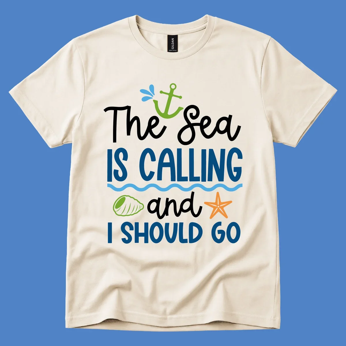 Gray tee design with 'The Sea Is Calling and I Should Go' text in white and blue, decorated with nautical icons including anchor, starfish, seashell, and ocean waves.