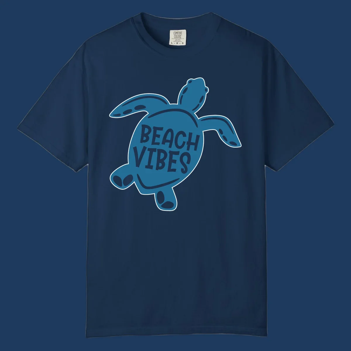 Teal sea turtle illustration with spotted shell pattern and 'Beach Vibes' text centered on the shell
