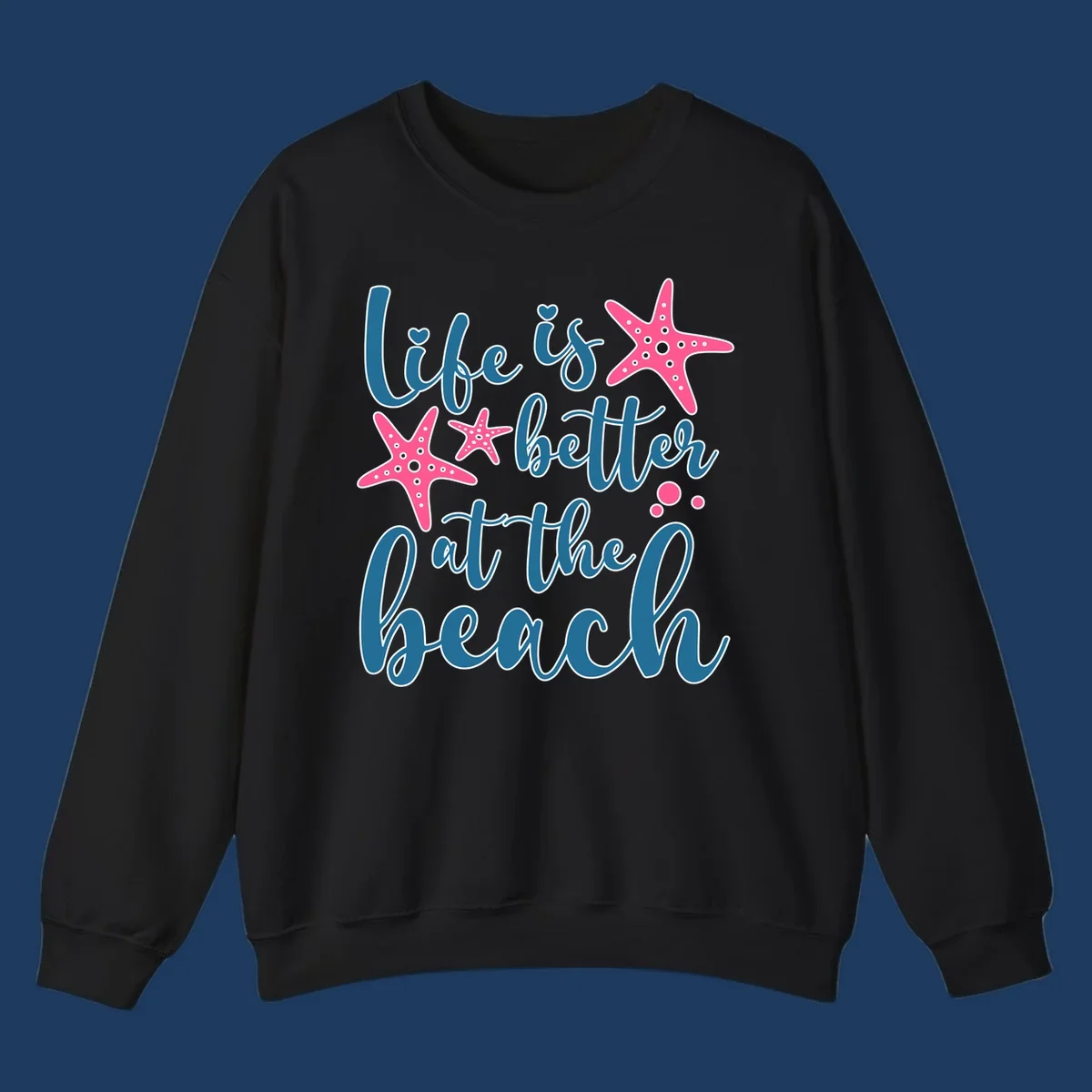 Life is better at the beach design with teal cursive text, pink starfish with white dots, and bubbles on gray background