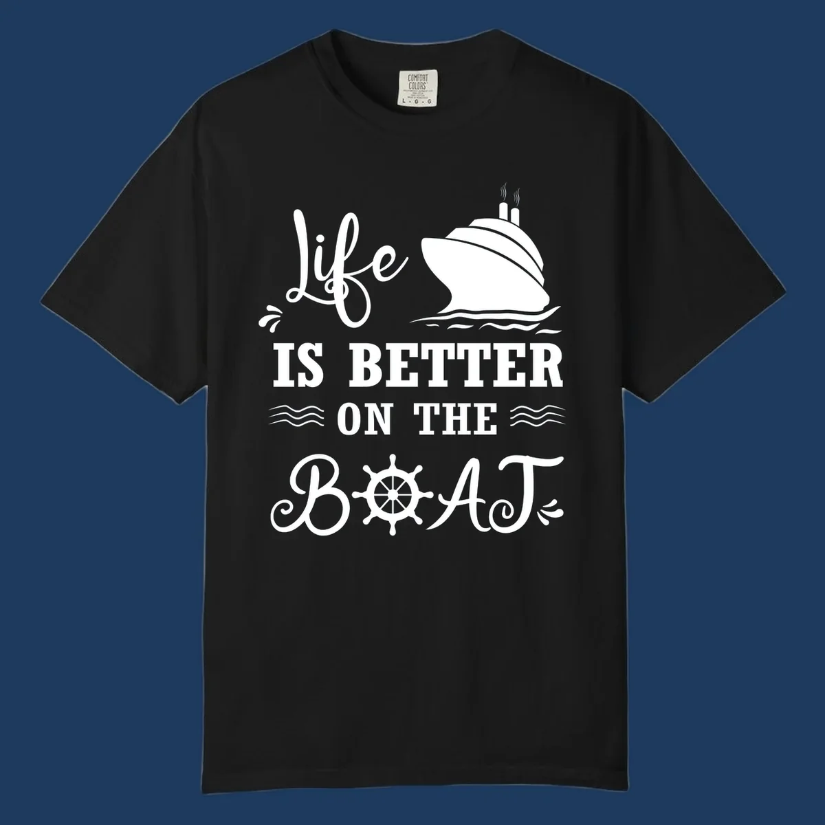 White nautical design on gray background with 'Life Is Better On The Boat' text, cruise ship, ship's wheel, and ocean waves
