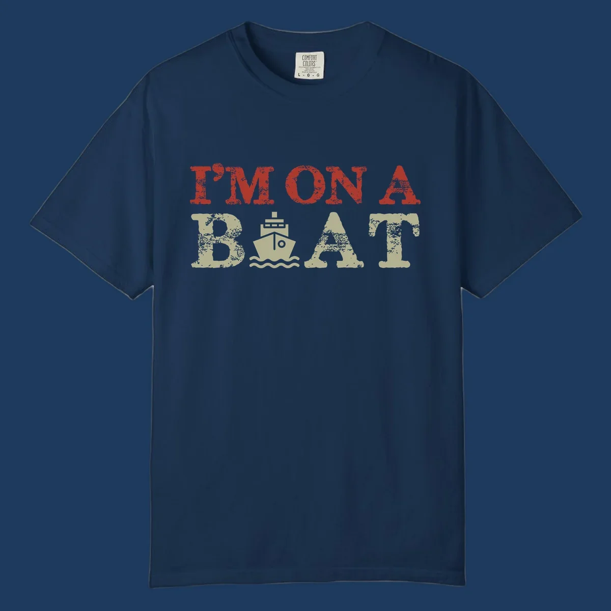 Red and cream distressed design featuring 'I'm On A Boat' text with ship and wave icons for cruise vacation apparel