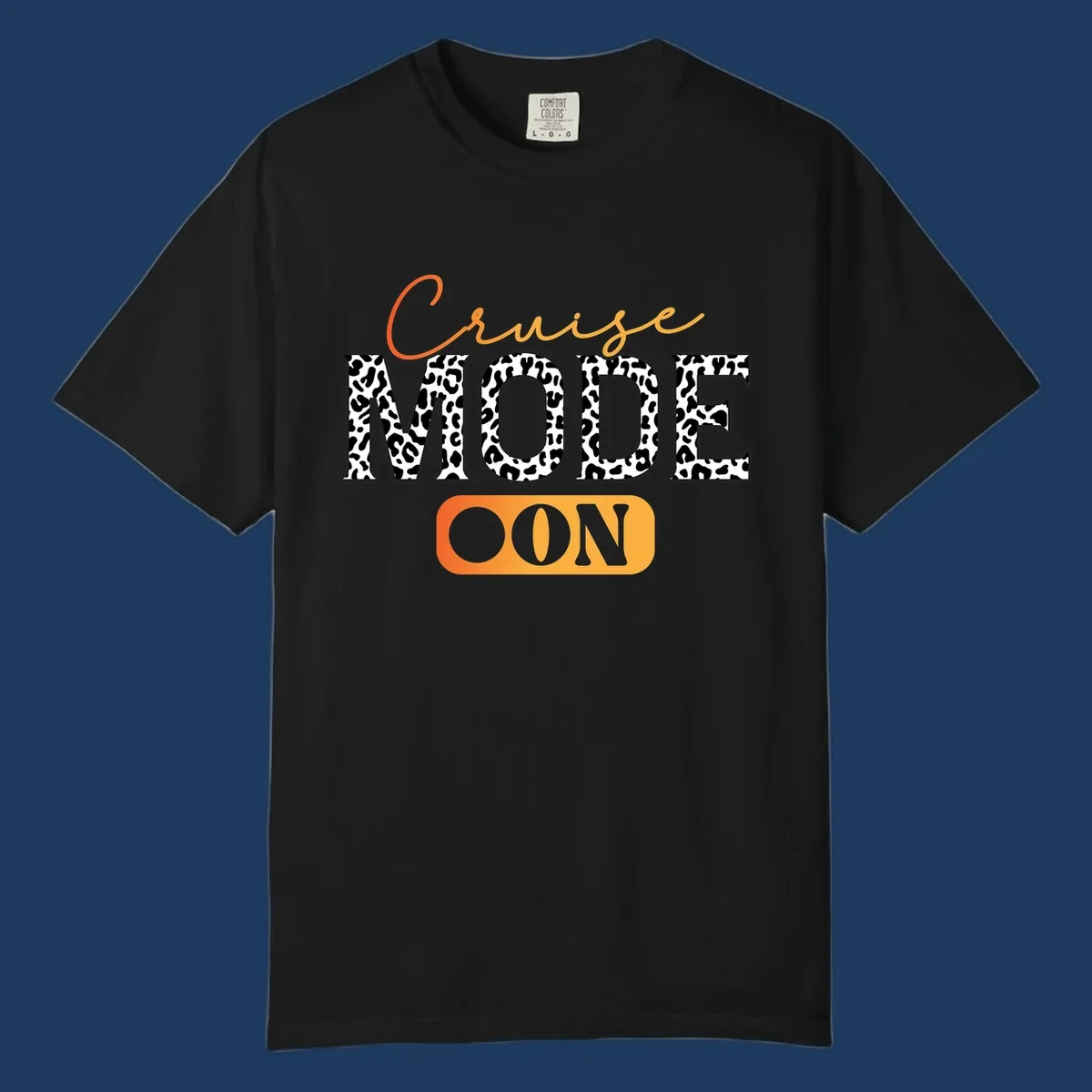 Cruise mode on design with orange cursive text and leopard print letters on gray background
