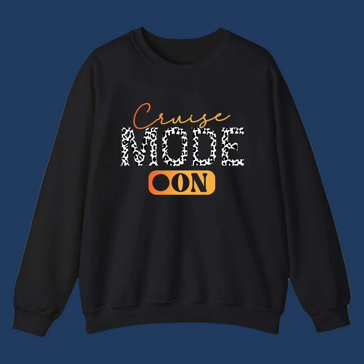 Cruise mode on design with orange cursive text and leopard print letters on gray background