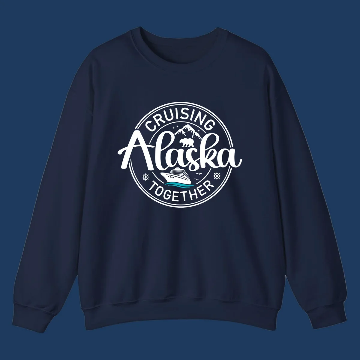 Circular badge design reading 'Cruising Alaska Together' with mountain, bear, and cruise ship illustrations in white and teal on gray background