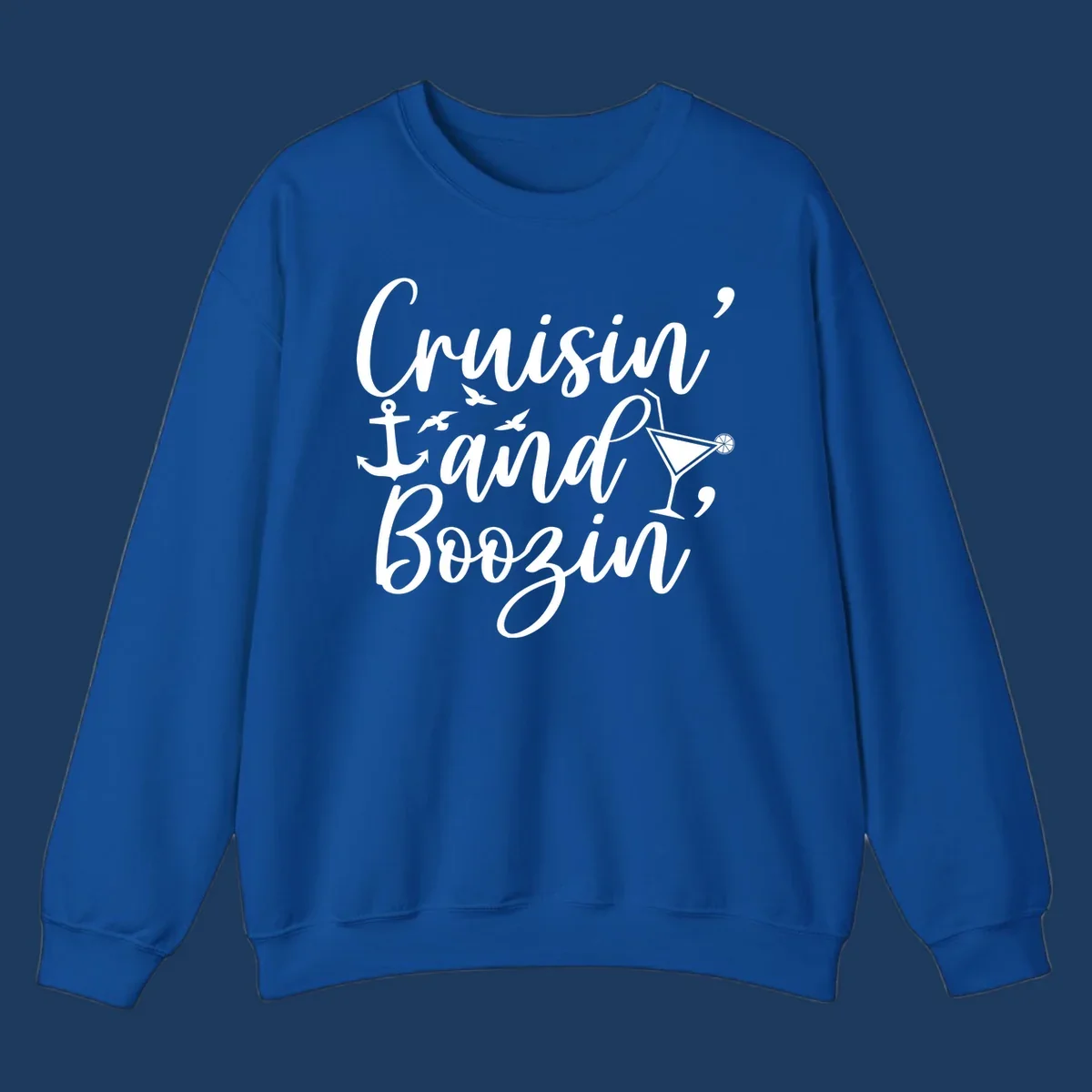 Cruisin and boozing nautical design with anchor, seagulls, and cocktail illustration on gray background