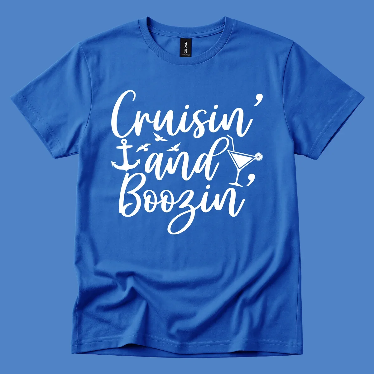 Cruisin and boozing nautical design with anchor, seagulls, and cocktail illustration on gray background