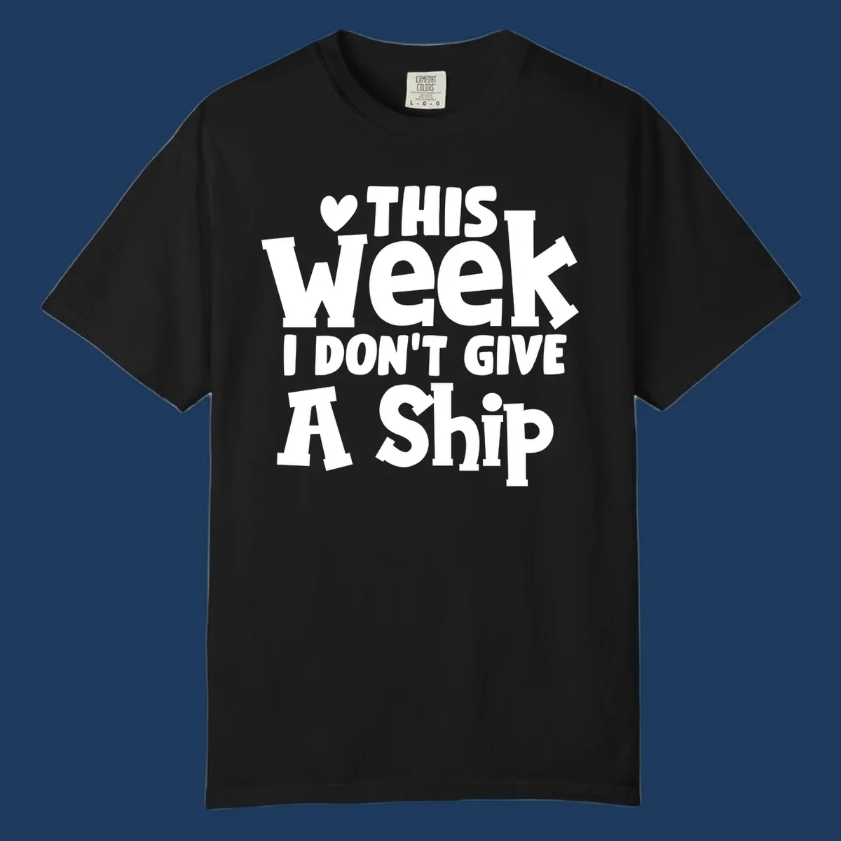 Bold white text reading 'Love This Week I Don't Give A Ship' with heart and arrow symbols on gray background