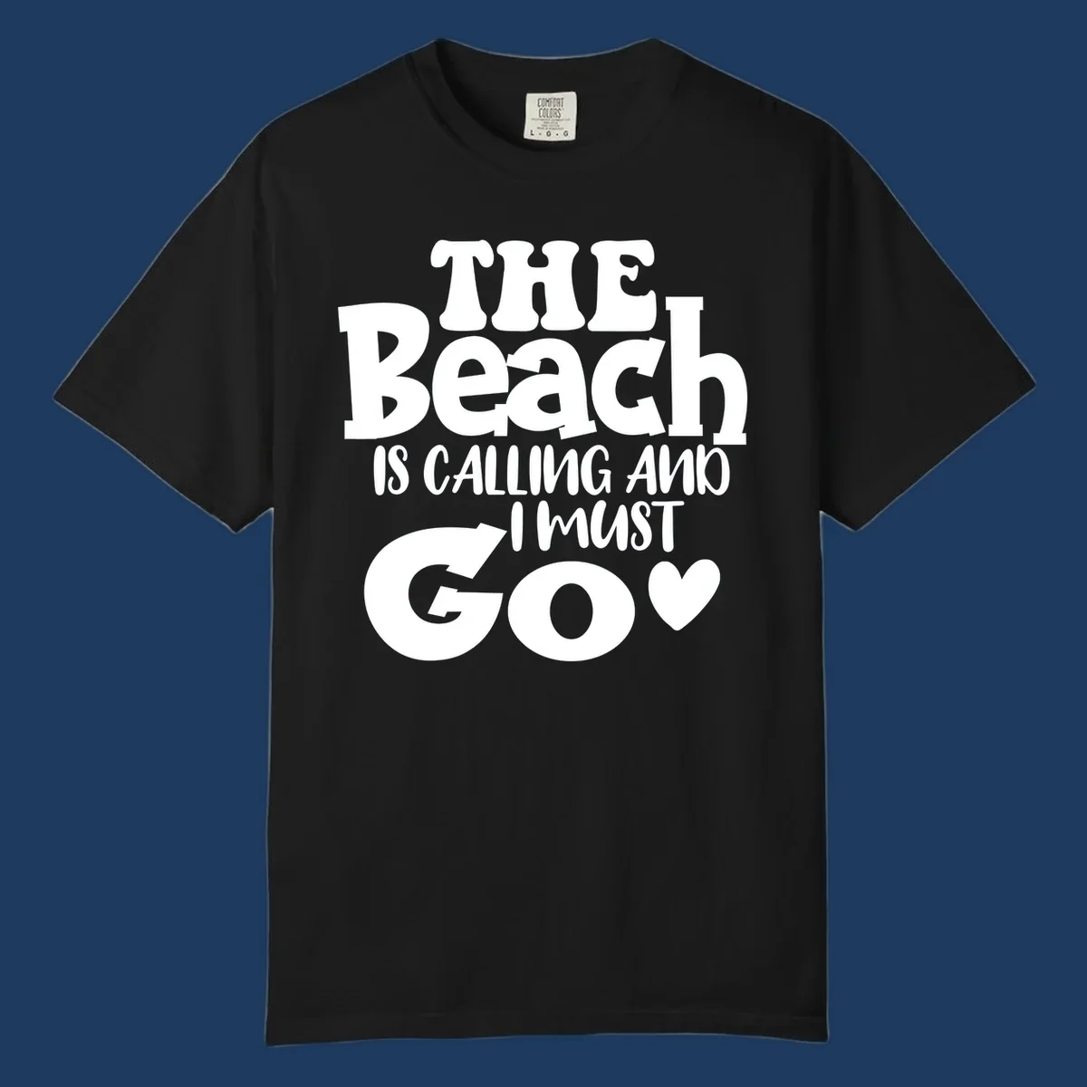 Beach is calling and I must go typography design with heart symbol, white text on gray background