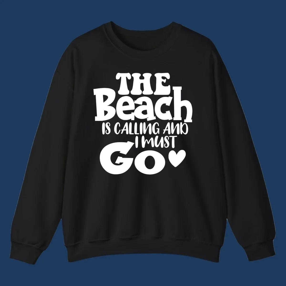 Beach is calling and I must go typography design with heart symbol, white text on gray background