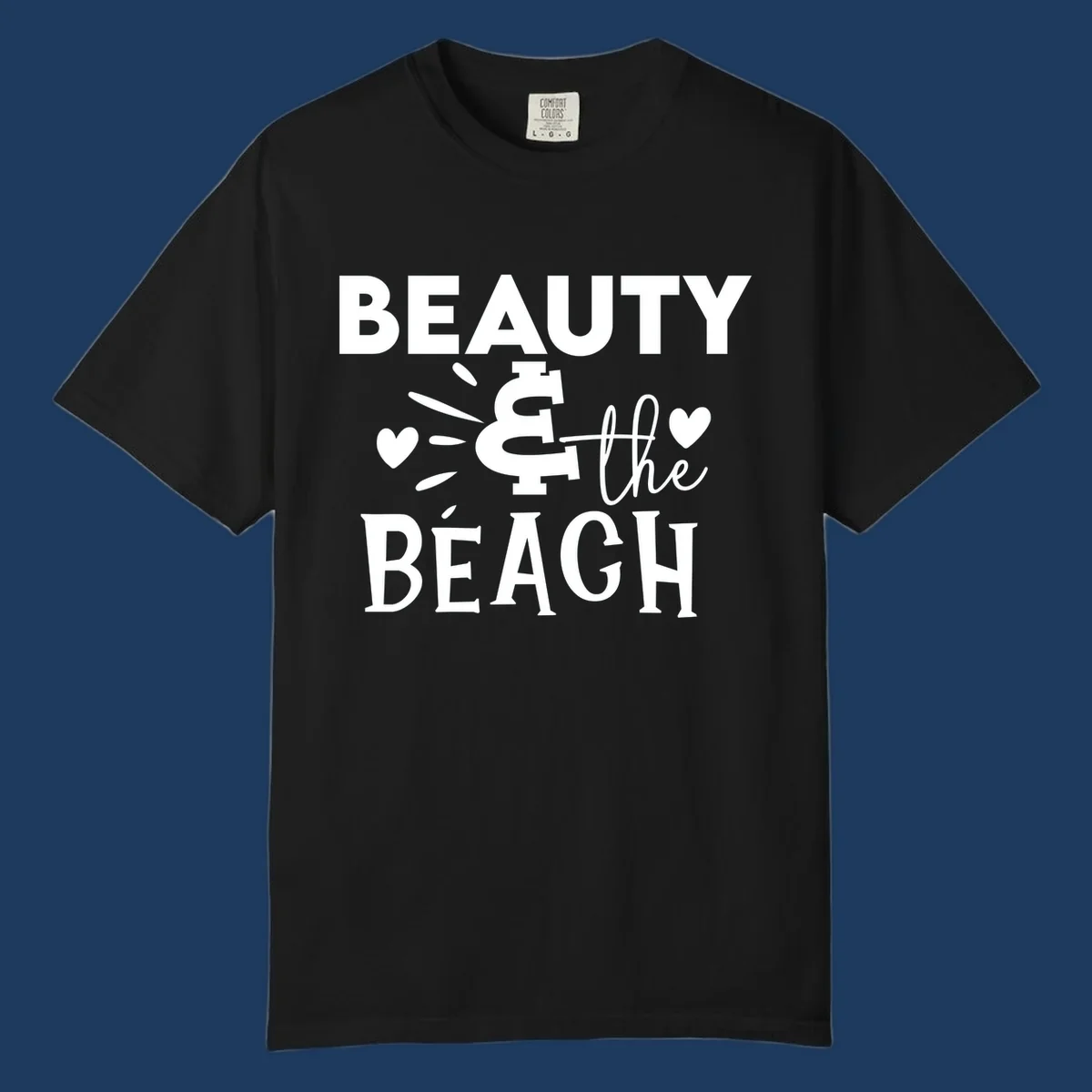 White text design reading 'Beauty & The Beach' with dollar sign symbol and heart decorations on gray background
