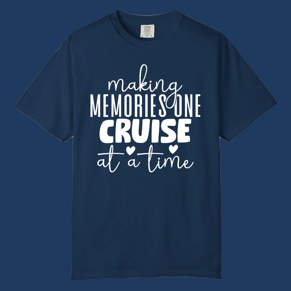 White text on gray background reading 'Making Memories One Cruise At A Time' with decorative hearts and flourishes for cruise vacation apparel