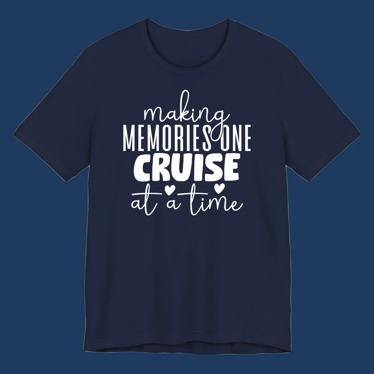 White text on gray background reading 'Making Memories One Cruise At A Time' with decorative hearts and flourishes for cruise vacation apparel