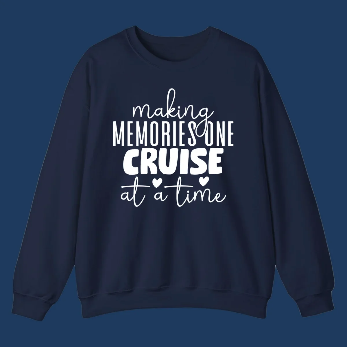 White text on gray background reading 'Making Memories One Cruise At A Time' with decorative hearts and flourishes for cruise vacation apparel