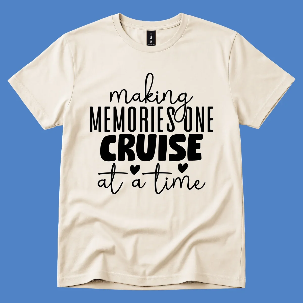 White text on gray background reading 'Making Memories One Cruise At A Time' with decorative hearts and flourishes for cruise vacation apparel
