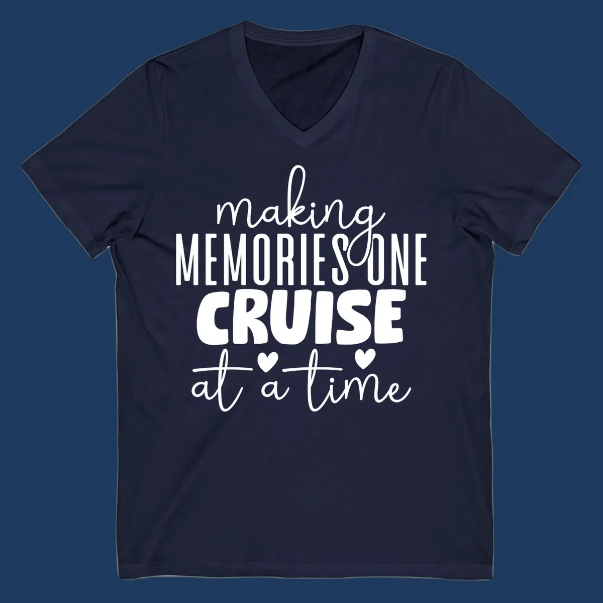 White text on gray background reading 'Making Memories One Cruise At A Time' with decorative hearts and flourishes for cruise vacation apparel