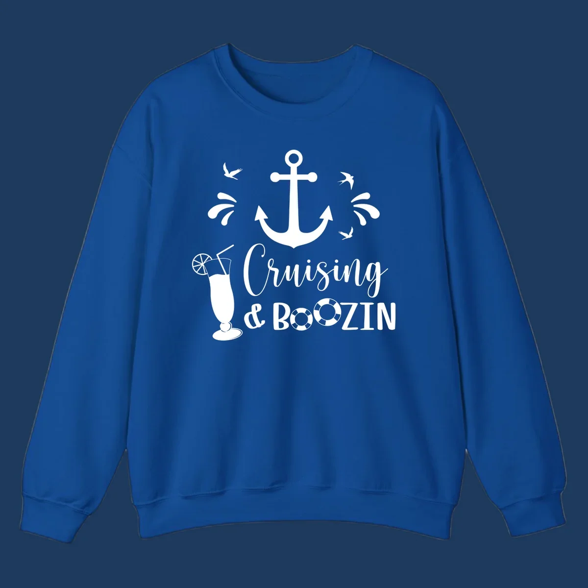 Cruising and boozin anchor design with nautical elements, cocktail, and seabirds on gray background