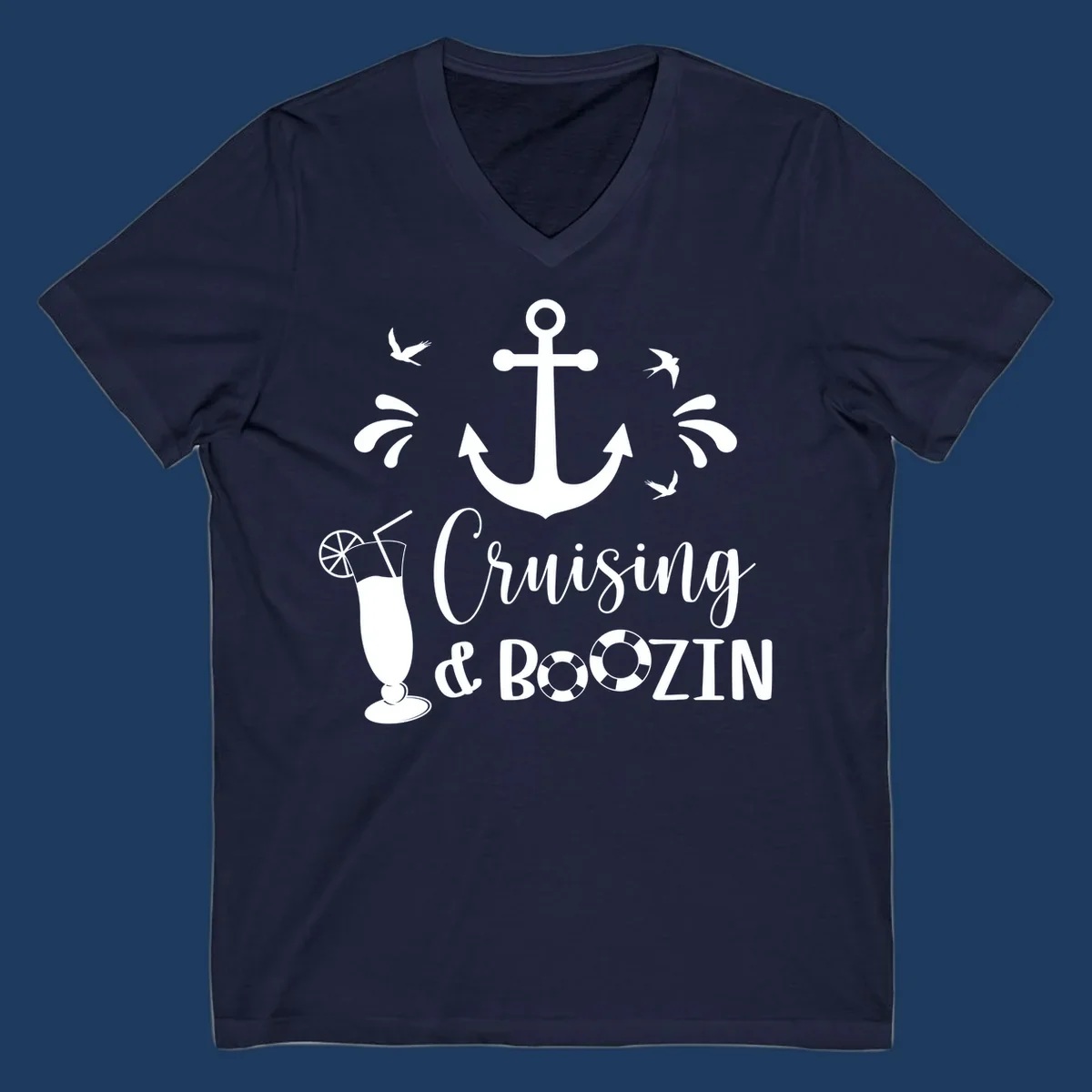 Cruising and boozin anchor design with nautical elements, cocktail, and seabirds on gray background