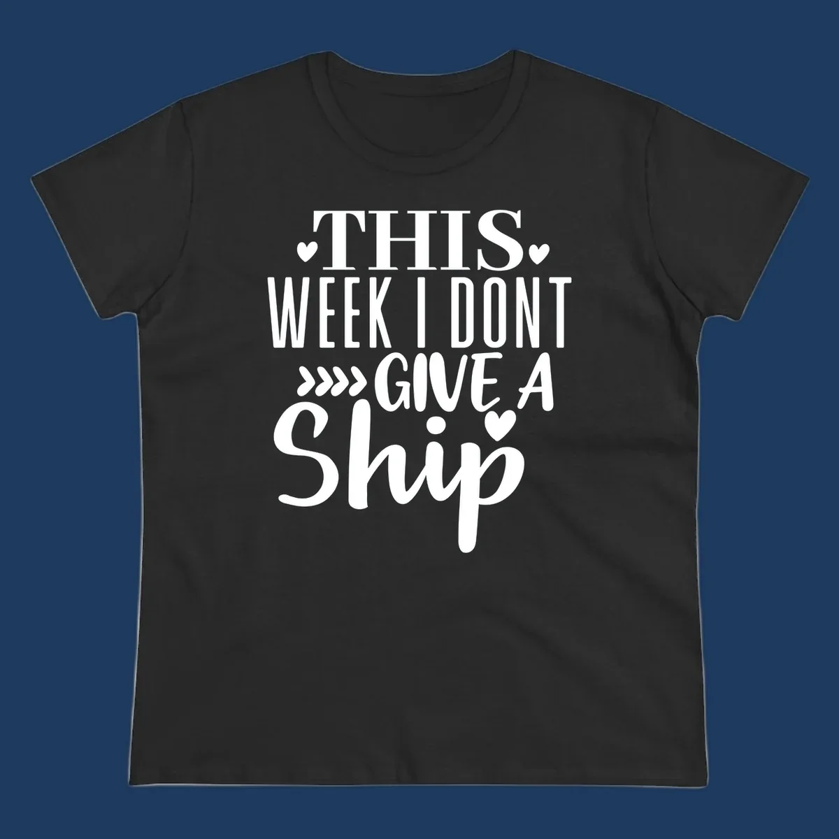 White text on gray background reading 'This Week I Don't Give A Ship' with hearts and arrows, a playful cruise humor design