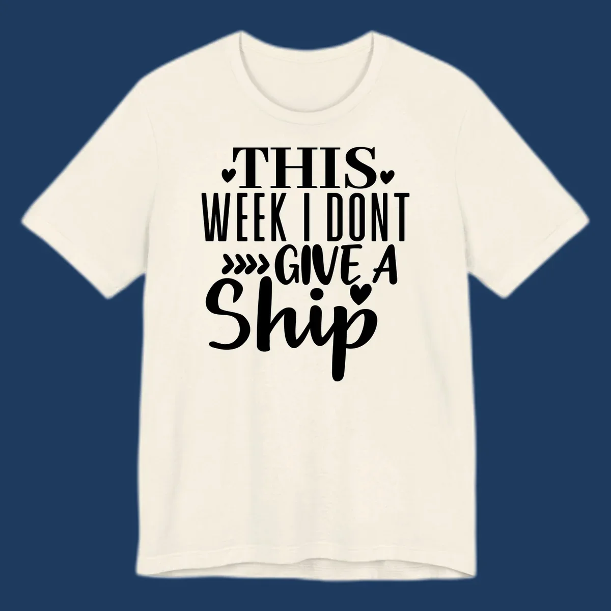 White text on gray background reading 'This Week I Don't Give A Ship' with hearts and arrows, a playful cruise humor design