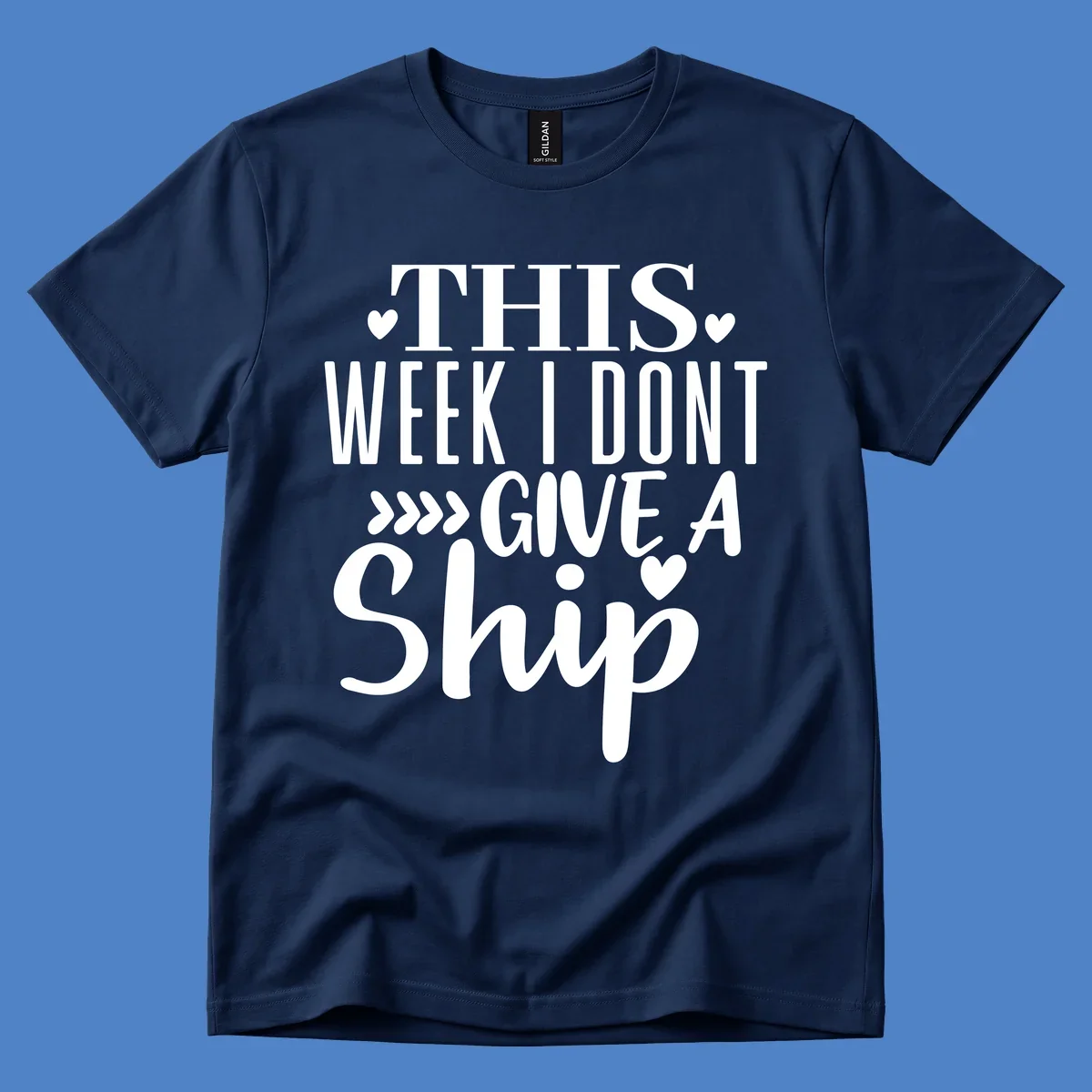 White text on gray background reading 'This Week I Don't Give A Ship' with hearts and arrows, a playful cruise humor design