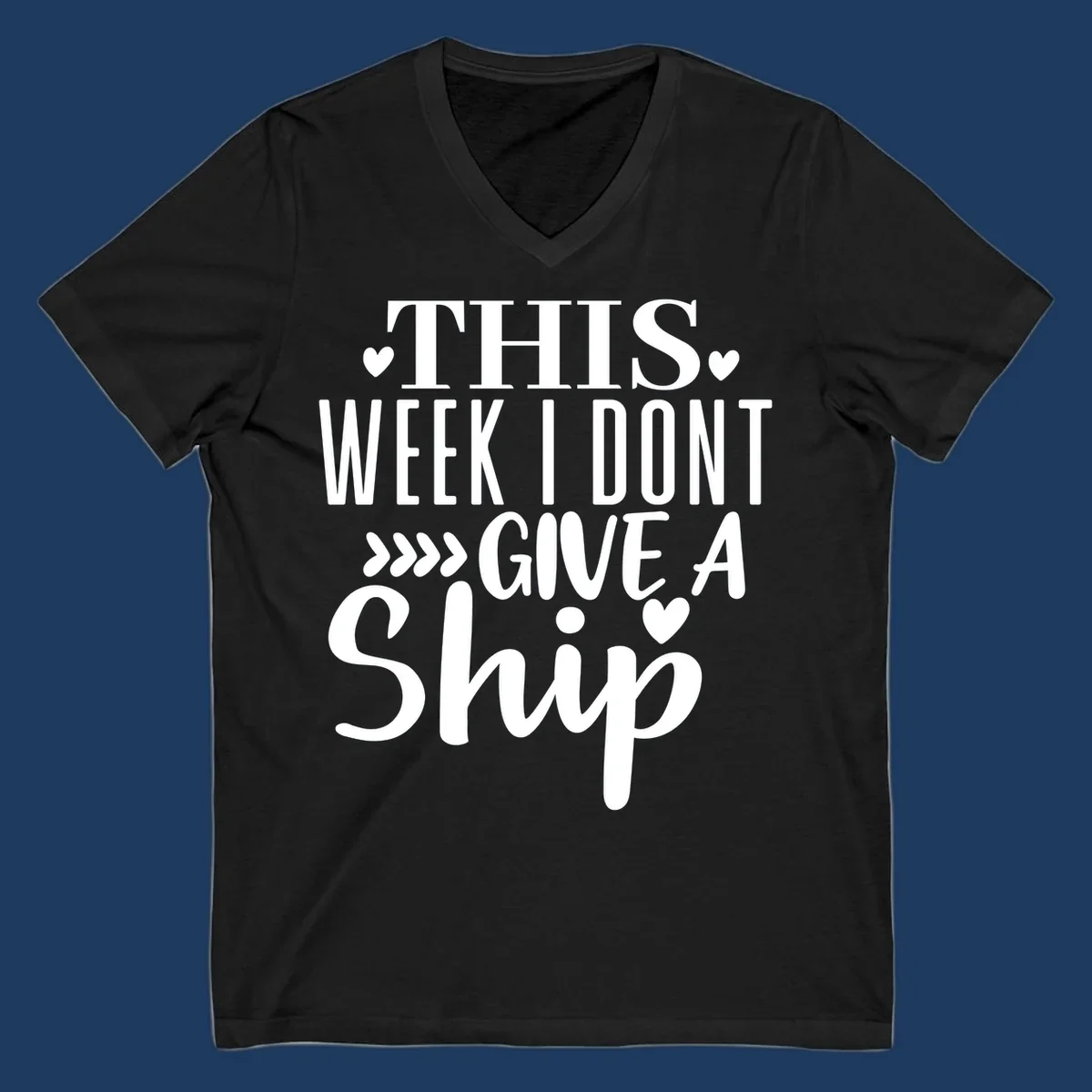 White text on gray background reading 'This Week I Don't Give A Ship' with hearts and arrows, a playful cruise humor design