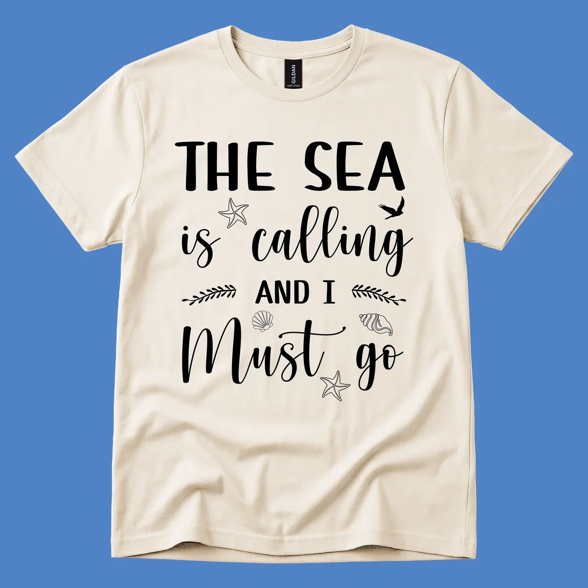 Gray design with white text reading 'The Sea is calling AND I MUST go' surrounded by starfish, seashells, a flying bird, and leaf accents