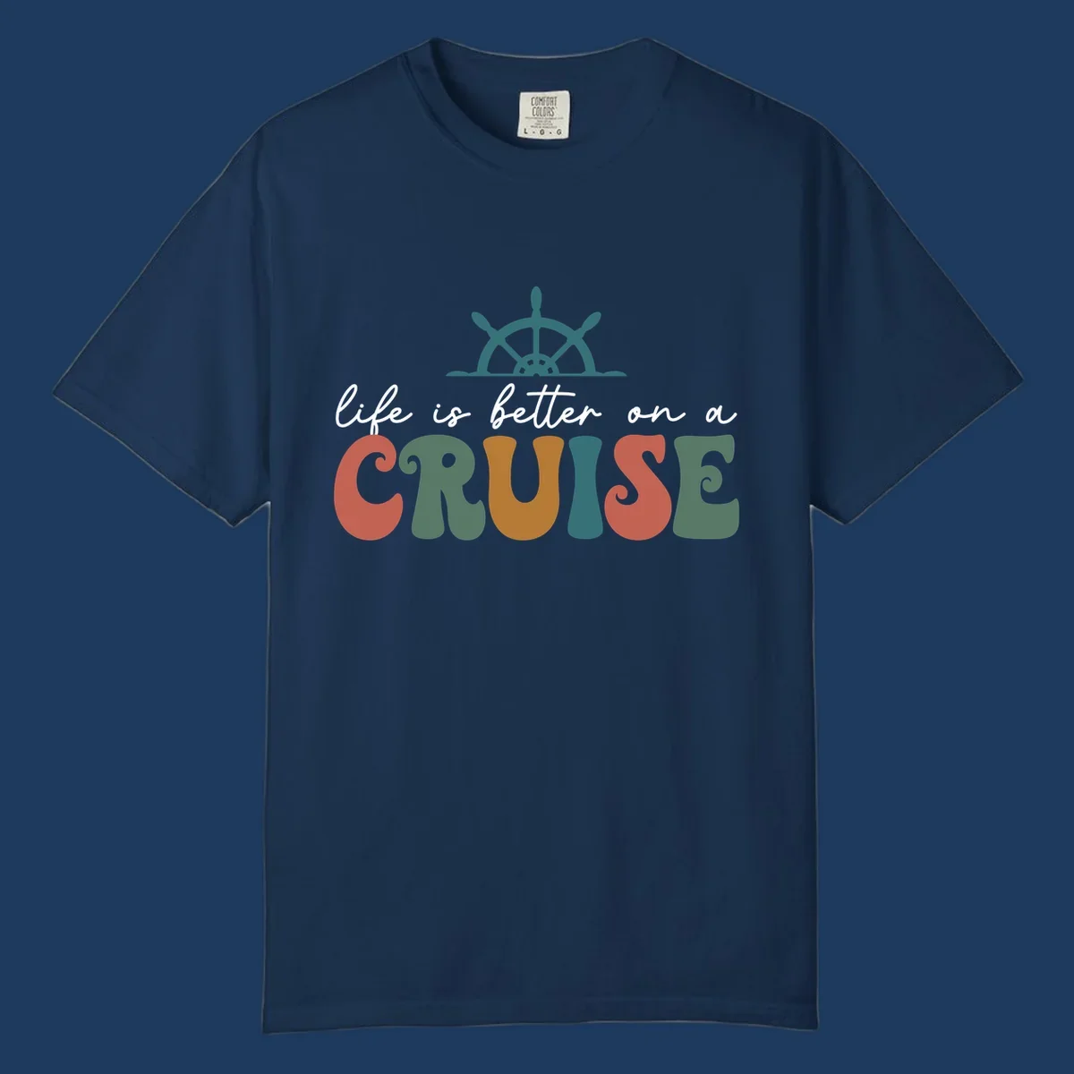 Life is better on a cruise design with ship's wheel and colorful text on gray background